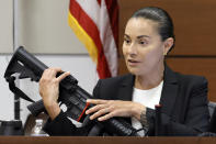 Broward Sheriff's Office Sgt. Gloria Crespo testifies about the weapon used by Marjory Stoneman Douglas High School shooter Nikolas Cruz in the 2018 shootings. This during the penalty phase of Cruz's trial at the Broward County Courthouse in Fort Lauderdale, Fla. on Tuesday, Sept. 27, 2022. Sgt. Crespo took the photograph (for evidence purposes) of the gun used by Cruz after the shootings. Cruz previously plead guilty to all 17 counts of premeditated murder and 17 counts of attempted murder in the 2018 shootings. (Amy Beth Bennett/South Florida Sun Sentinel via AP, Pool)