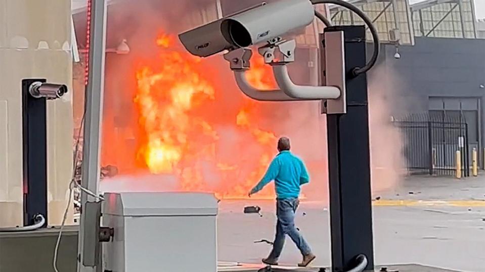 PHOTO: A person watches after a vehicle exploded at the Rainbow Bridge connecting the U.S. and Canada in Niagara Falls, New York, Nov. 22, 2023. (@sal.alwishah/Instagram)