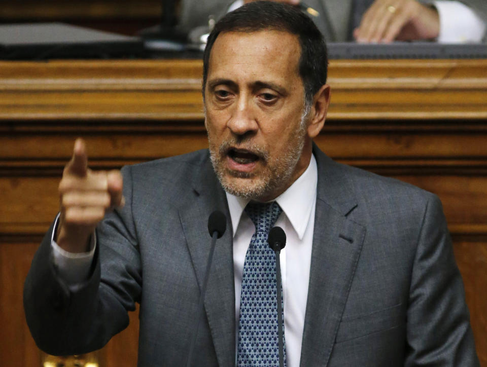FILE - In this Jan. 22, 2016 file photo, opposition lawmaker Jose Guerra speaks during National Assembly session in Caracas, Venezuela. On Monday, Aug. 12, 2019, Venezuela’s supreme court stripped Guerra and two other opposition lawmakers of immunity from prosecution as accused traitors amid rising political tension in the crisis-stricken nation. (AP Photo/Ariana Cubillos, File)