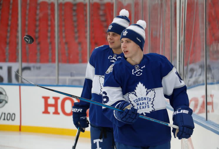 Maple Leafs rookies Auston Matthews (background) and Mitch Marner (foreground) are leading the turnaround in Toronto. (Mark Blinch/Getty Images)