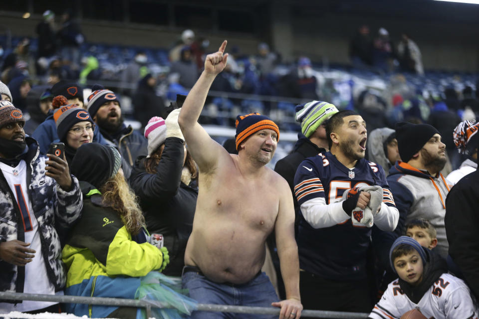 Chicago Bears fans cheer after their team defeated the Seattle Seahawks in an NFL football game, Sunday, Dec. 26, 2021, in Seattle. (AP Photo/Lindsey Wasson)