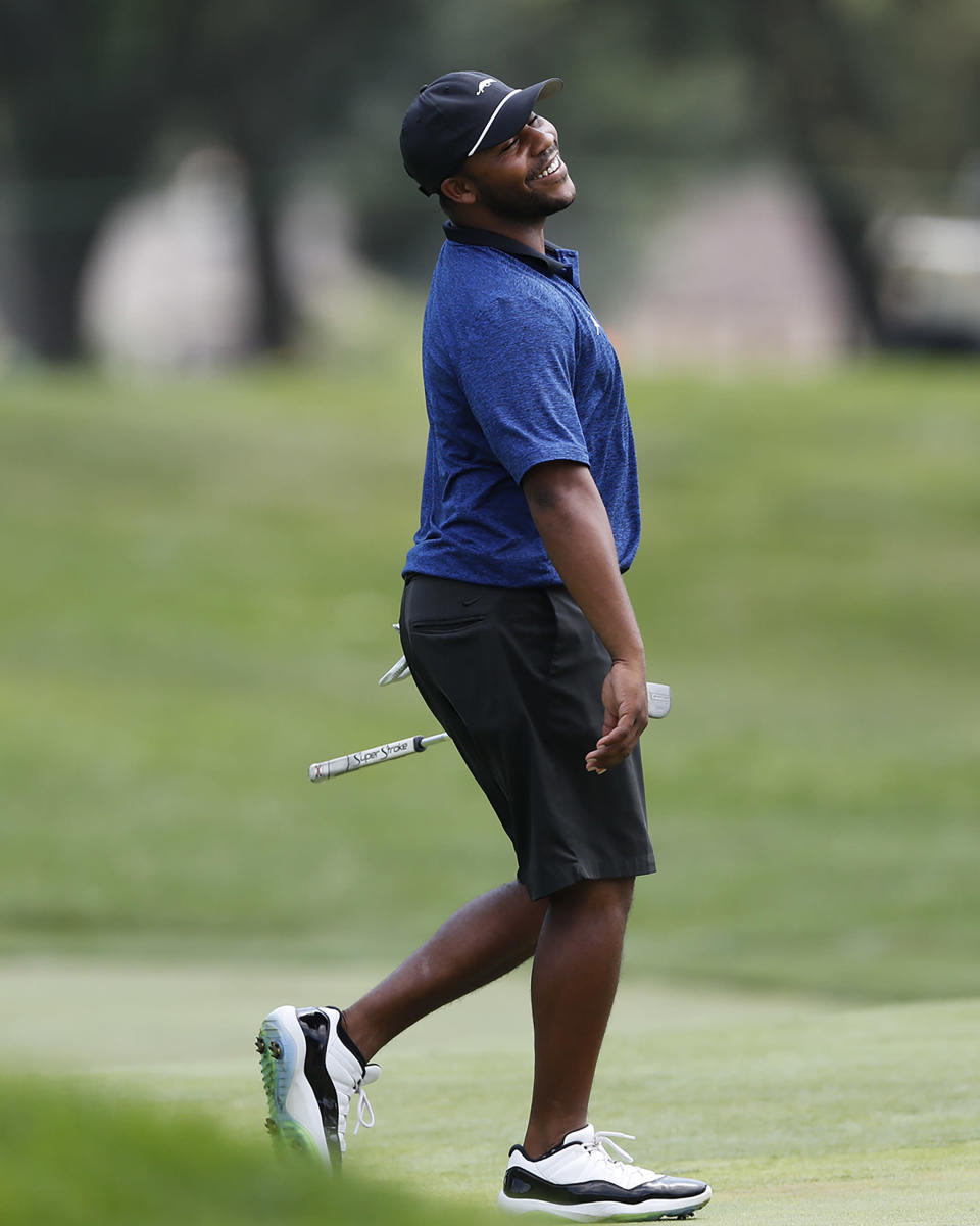 Harold Varner III reacts after a shot on the 17th green during a nine-hole exhibition ahead of the RocketMortgage Classic golf tournament, Wednesday, July 1, 2020, at the Detroit Golf Club in Detroit. (AP Photo/Carlos Osorio)