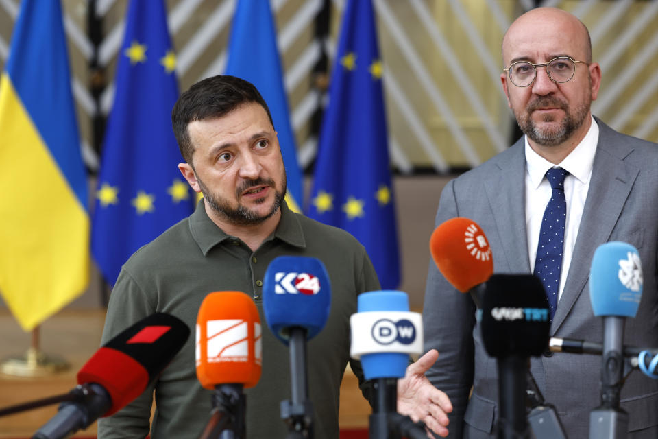 Ukraine's President Volodymyr Zelenskyy, left, and European Council President Charles Michel speak with the media as they arrive for an EU summit in Brussels, Thursday, June 27, 2024. European Union leaders are expected on Thursday to discuss the next EU top jobs, as well as the situation in the Middle East and Ukraine, security and defence and EU competitiveness. (AP Photo/Geert Vanden Wijngaert)