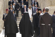 <p>U.S. President Donald Trump, center left and first lady Melania visit the Church of the Holy Sepulchre, in Jerusalem, Monday, May 22, 2017. Trump opened his first visit to Israel Monday, a two-day stop aimed at testing the waters for jumpstarting the dormant Middle East peace process. (AP Photo/Evan Vucci) </p>