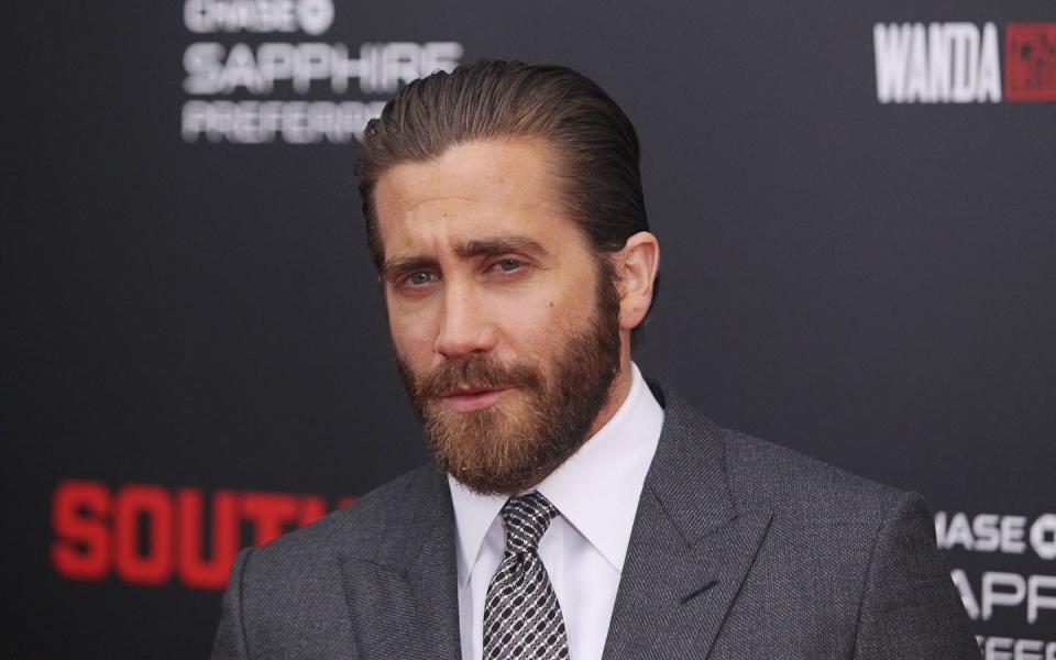 <p>Jake's slicked back hair goes well with his tailored beard.</p>