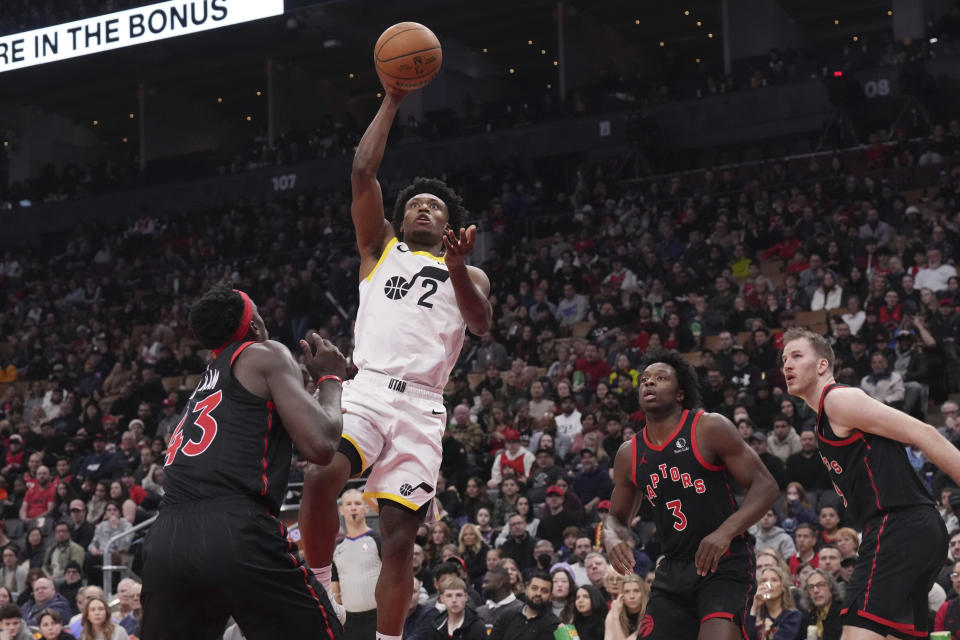 Utah Jazz guard Collin Sexton (2) goes up to score against the Toronto Raptors during first-half NBA basketball game action in Toronto, Saturday, Dec. 23, 2023. (Chris Young/The Canadian Press via AP)