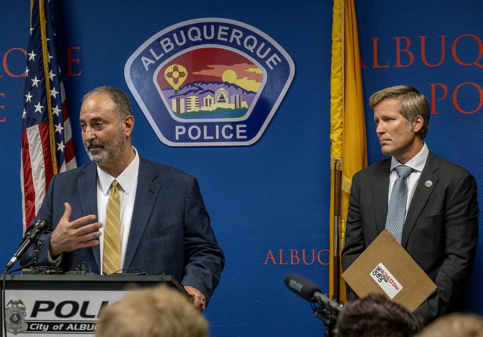 Ahmad Assed, president of the Islamic Center of New Mexico, left, speaks at a news conference to announce the arrest of Muhammad Syed, a suspect in the recent murders of Muslim men in Albuquerque, N.M., as Albuquerque Mayor Tim Keller listens, at right, Tuesday, Aug. 9, 2022. (Adolphe Pierre-Louis/The Albuquerque Journal via AP) ORG XMIT: NMALJ232