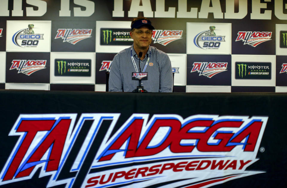 Auburn coach Gus Malzahn speaks at a press conference before the GEICO 500 NASCAR Talladega auto race at Talladega Superspeedway, Sunday, April 29, 2018, in Talladega, Ala. (AP Photo/Butch Dill)