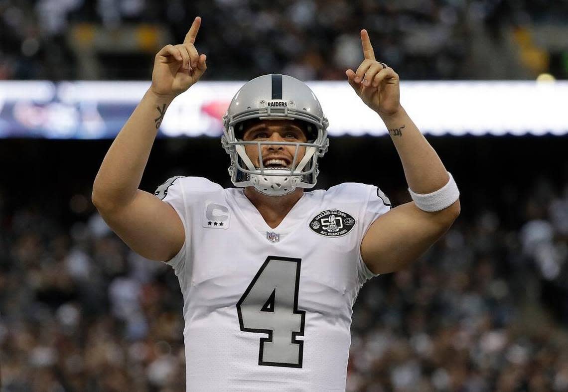 Derek Carr reacts after throwing for a touchdown against the Kansas City Chiefs in Oakland, Calif., Thursday, Oct. 19, 2017.