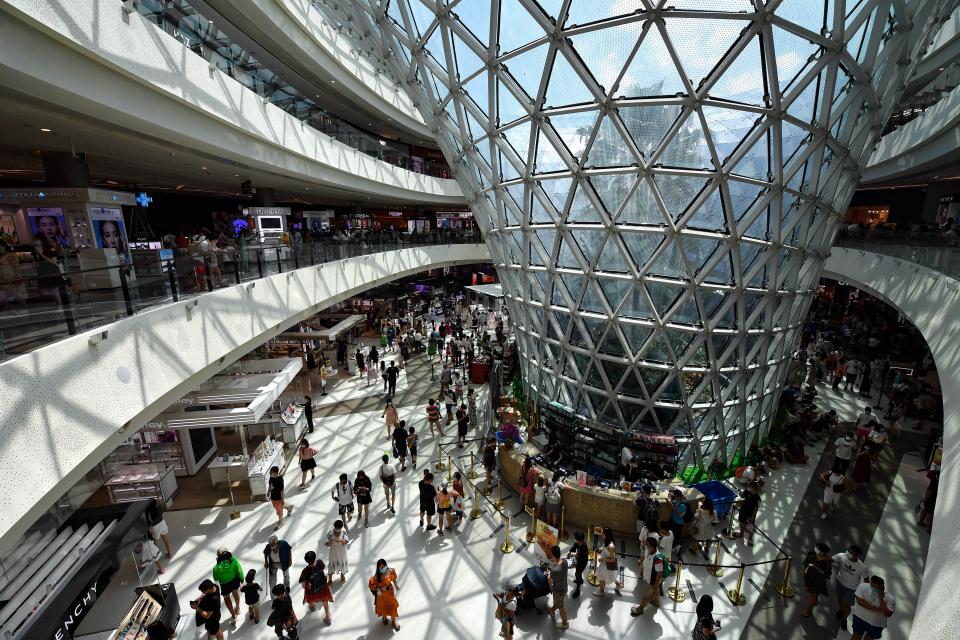 Tourists visit a duty-free shopping mall in Sanya. - Credit: Xinhua News Agency via Getty Ima