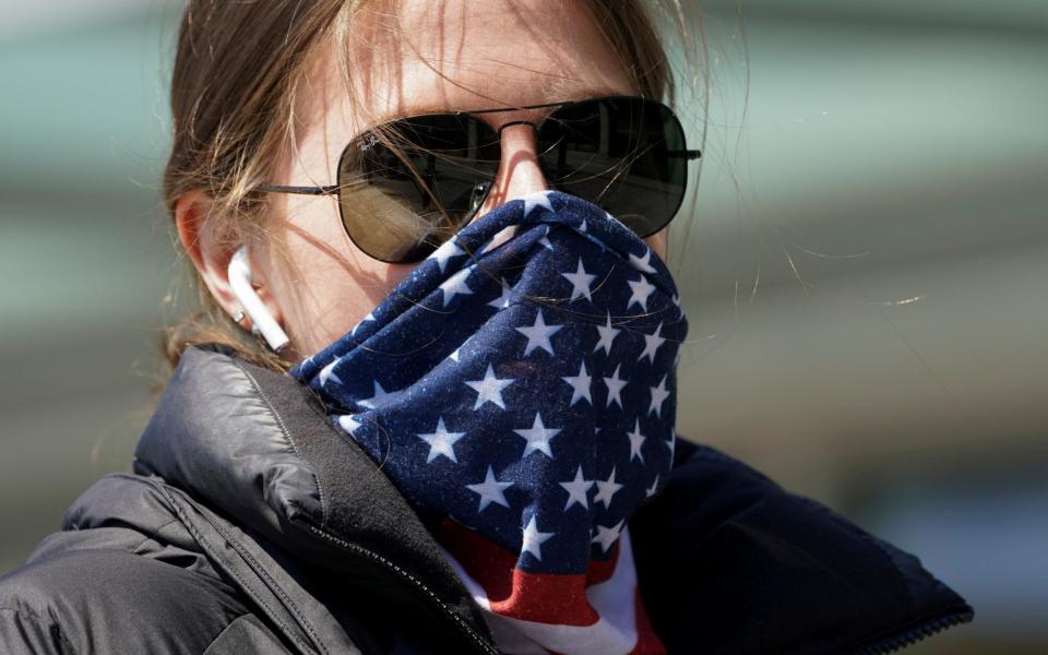 Americans should wear a scarf and void buying medical-grade face masks, the White House said - Kevin Lamarque/Reuters