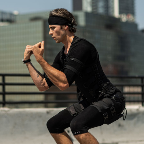 man working out outside while wearing katalyst strength training suit