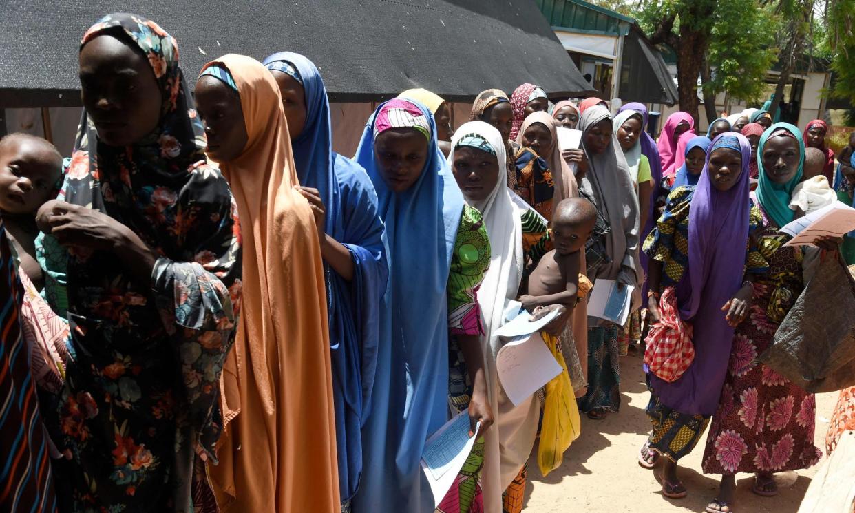 <span>Mothers queue for an MSF clinic with their malnourished children in Katsina State, north-west Nigeria. </span><span>Photograph: Pius Utomi Ekpei/AFP/Getty Images</span>