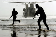 In this photo released Tuesday, Jan. 19, 2021, by the Iranian Army, troops participate in a military drill. Iran's military kicked off a ground forces drill on Tuesday along the coast of the Gulf of Oman, state TV reported, the latest in a series of snap exercises that the country is holding amid escalating tensions over its nuclear program and Washington's pressure campaign against Tehran. (Iranian Army via AP)