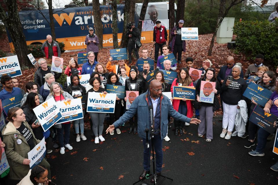 Georgia Democratic Senate candidate U.S. Sen. Raphael Warnock (D-GA) speaks to supporters during a pre-canvassing event December 6, 2022 in Norcross, Georgia.