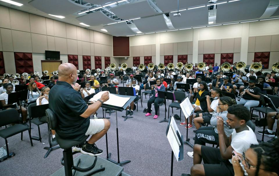 Bethune-Cookman University Marching Wildcats Band Director Donovan Wells conducts the musicians during practice, Tuesday, Aug. 30, 2022.