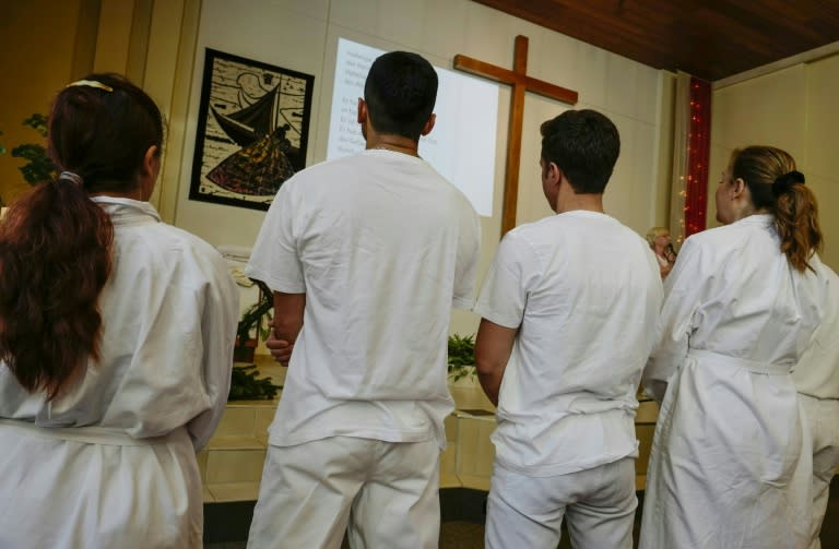 Newly-converted Muslim refugees attend a Baptism ceremony at the Evangelisch-Freikirchliche Gemeinde church in Berlin