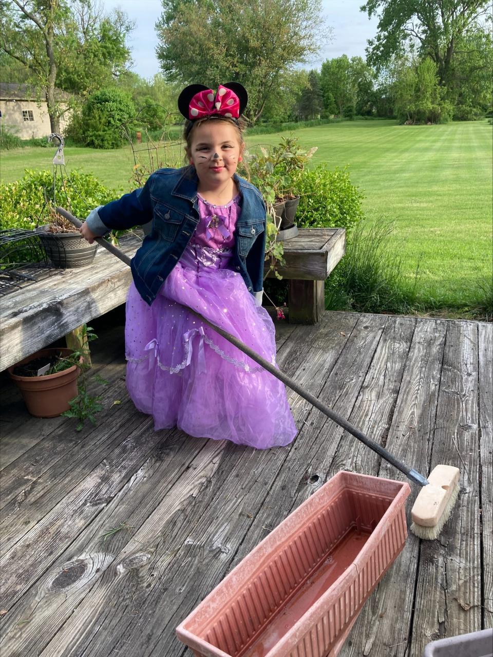 Sophia Faith Berry loves to dress up. She often goes over to her neighbor's house to bring her food, get her mail, visit and even helps clean up. Here, Sofia is in her first dress and Minnie Mouse ears. She just wanted to help her dear friend and neighbor. Provided by Jodi Berry