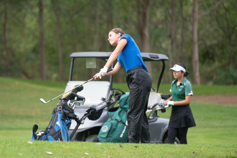 Harper Creek's Arabella Stanley hits the ball during the All-City girls golf tournament at Riverside Golf Club on Friday, Sept. 27, 2024.