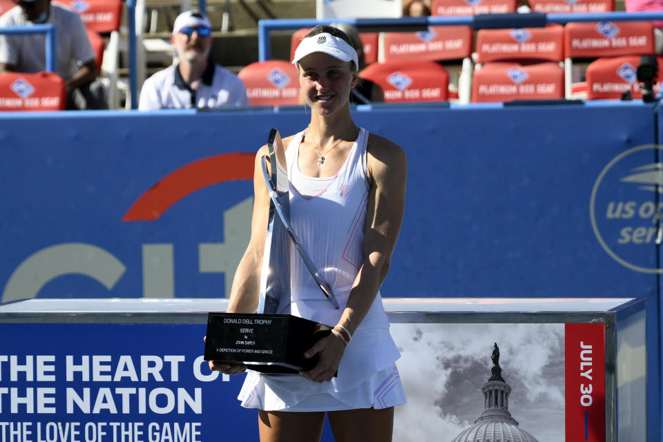 Liudmila Samsonova, of Russia, poses with the trophy after she won the final at the Citi Open tennis tournament against Kaia Kanepi, of Estonia, Sunday, Aug. 7, 2022, in Washington. (AP Photo/Nick Wass)