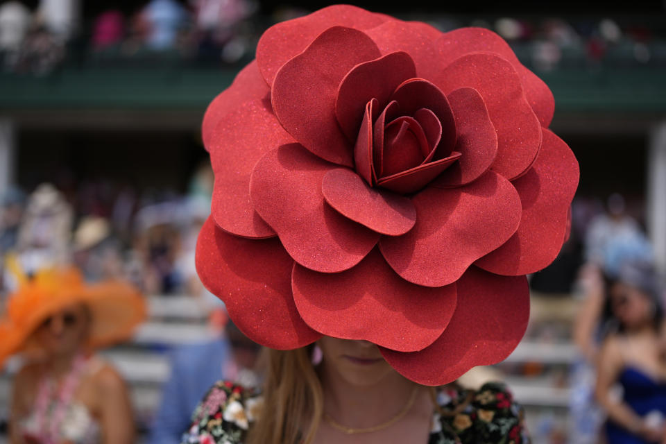 A race fan walks though the stands at Churchill Downs before the 150th running of the Kentucky Derby horse race Saturday, May 4, 2024, in Louisville, Ky. (AP Photo/Brynn Anderson)