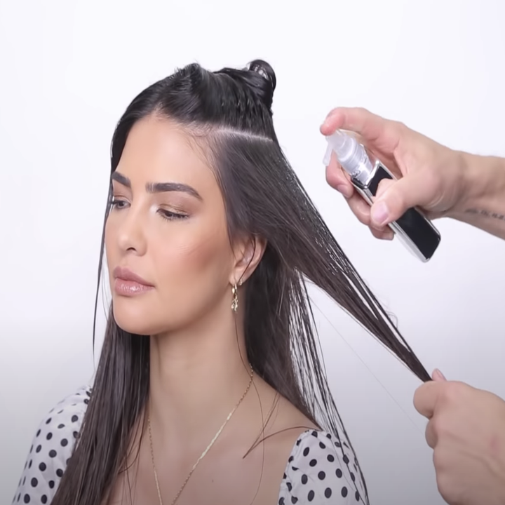 product being sprayed in hair