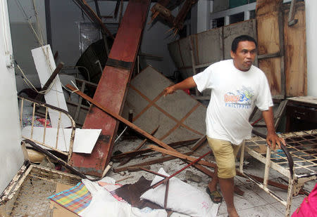 A man inspects damage at Caraga Regional hospital after an earthquake hit Surigao city, southern Philippines February 10, 2017. Picture taken February 10, 2017. REUTERS/Roel Catoto-Mindanews