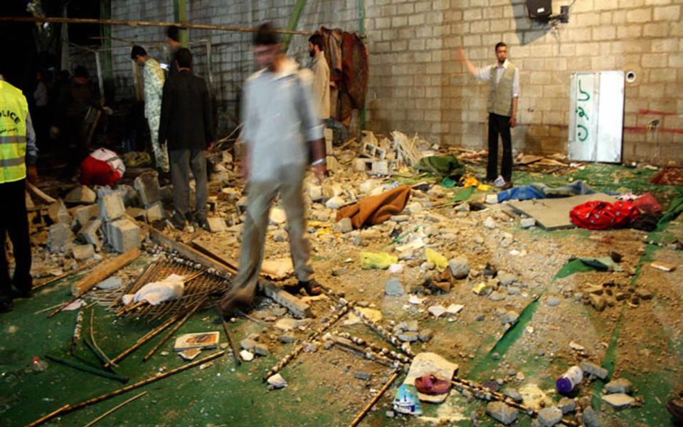 In 2008, Iranians inspect the site of an explosion inside a mosque in the southern city of Shiraz which killed 14 - STR/AFP