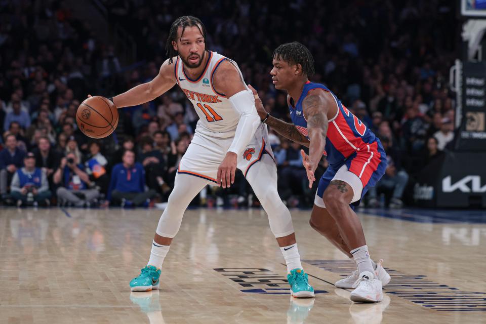 New York Knicks guard Jalen Brunson (11) dribbles as Detroit Pistons guard Marcus Sasser (25) defends during the first half at Madison Square Garden in New York on Thursday, Nov. 30, 2023.