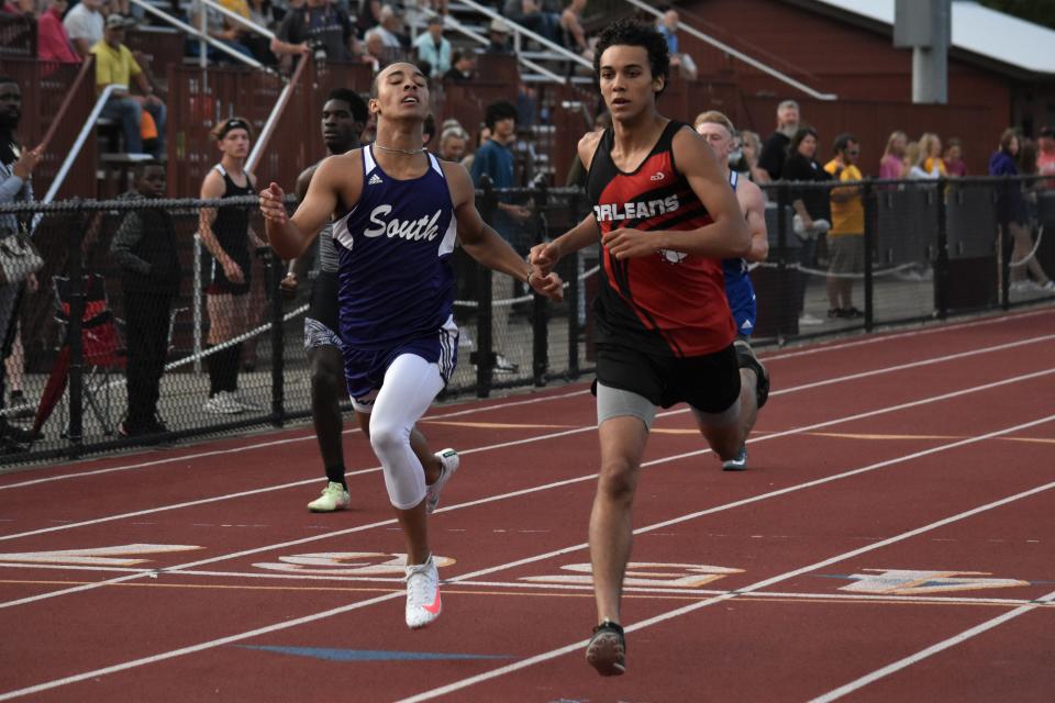 Orleans' Xavier Alston strides out after outpacing Bloomington South's Murry Ross-Harman to win the 400-meter dash at the 2022 Bloomington North Boys' Track and Field Regional.