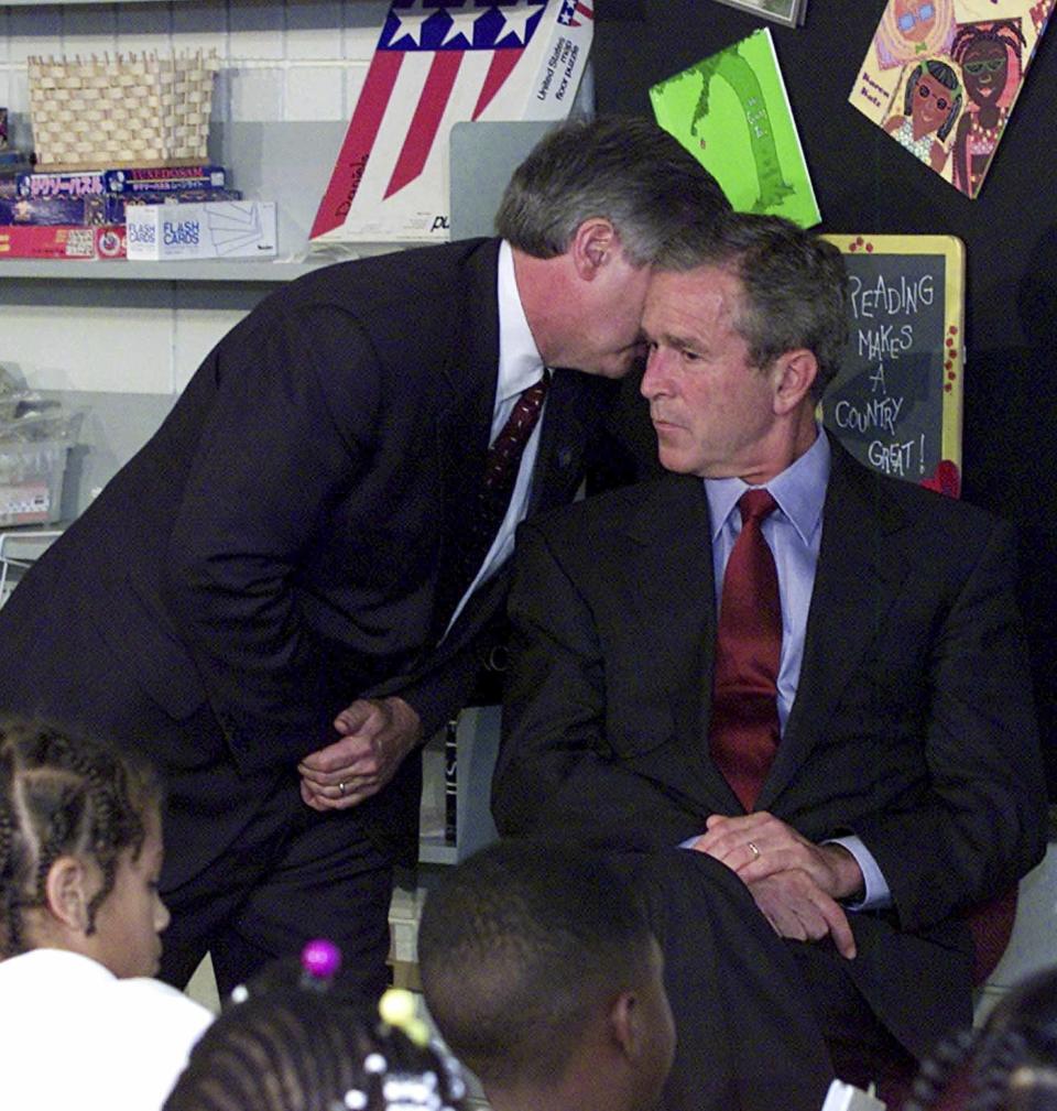 FILE - In this Tuesday, Sept. 11, 2001 file photo, Chief of Staff Andy Card whispers into the ear of President George W. Bush to give him word of the plane crashes into the World Trade Center, during a visit to the Emma E. Booker Elementary School in Sarasota, Fla. (AP Photo/Doug Mills, File)