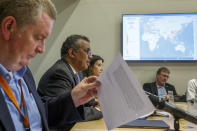 FILE - In this Monday, March 9, 2020 file photo, Tedros Adhanom Ghebreyesus, second left, director-general of the World Health Organization speaks during a news conference on updates regarding on the COVID-19 coronavirus at WHO headquarters in Geneva, Switzerland. At left is Michael Ryan, executive director of WHO's Health Emergencies program, and at third left is Maria van Kerkhove, technical lead of WHO's Health Emergencies program. Two days later, the WHO declared the new coronavirus a pandemic, suggesting the disease is spreading across the globe unchecked. WHO staffers debated how to press China for gene sequences and detailed patient data without angering authorities, worried about losing access and getting Chinese scientists into trouble. (Salvatore Di Nolfi/Keystone via AP)