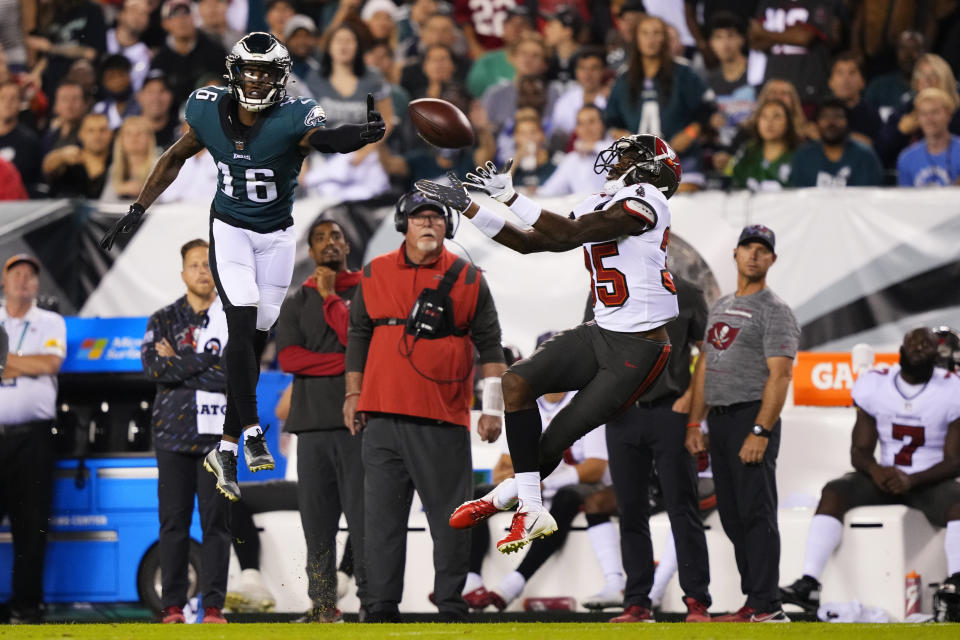 Tampa Bay Buccaneers cornerback Jamel Dean (35) intercepts a pass intended for Philadelphia Eagles wide receiver Quez Watkins (16) during the first half of an NFL football game Thursday, Oct. 14, 2021, in Philadelphia. (AP Photo/Matt Slocum)