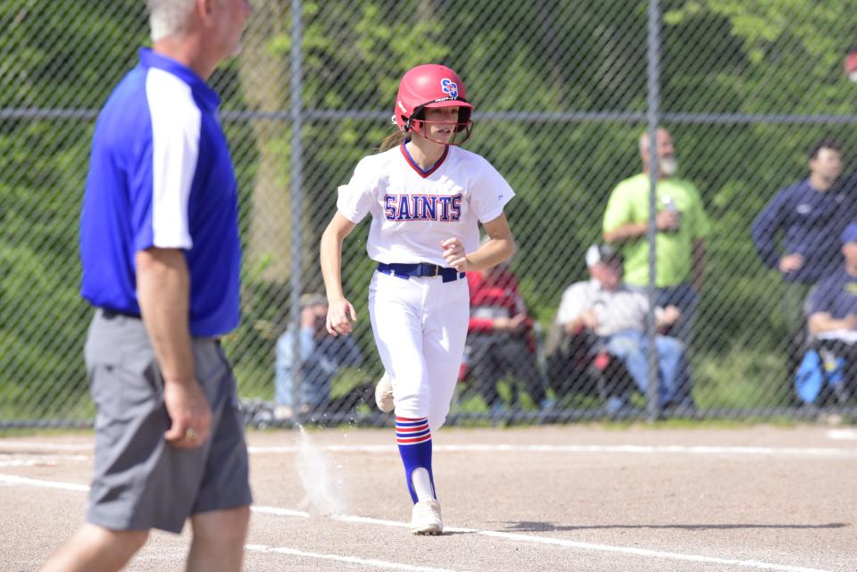 St. Clair's Lainey Pavlov runs to first base during a game earlier this season. She's one of five seniors that helped the Saints lay the foundation for what coach Libby Cody is trying to build.