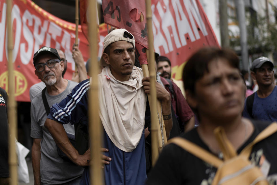 Anti-government demonstrators protest against food scarcity at soup kitchens and economic reforms proposed by President Javier Milei, in Buenos Aires, Argentina, Monday, March 18, 2024. A self-described anarcho-capitalist, Milei took office in December and almost immediately announced a series of shock measures, including a 50% devaluation of the nation’s currency, in hopes of eventually bringing the roaring inflation under control. (AP Photo/Rodrigo Abd)