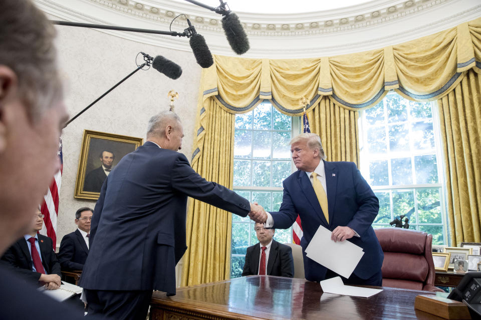 President Donald Trump shakes hands with Chinese Vice Premier Liu He after being given a letter in the Oval Office of the White House in Washington, Friday, Oct. 11, 2019. (Photo: ASSOCIATED PRESS)