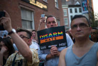 <p>People observe a moment of silence after victims names’ were read during a memorial service and rally for the victims of the 2016 Pulse nightclub shooting, down the street from the historic Stonewall Inn June 12, 2017 in New York City. Monday marks the one year anniversary of the Pulse nightclub shooting in Orlando, Florida that killed 49 people. (Photo: Drew Angerer/Getty Images) </p>