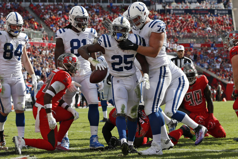 Indianapolis Colts running back Marlon Mack celebrates with offensive tackle Braden Smith (72) after his 2-yard touchdown run during the first half of an NFL football game against the Tampa Bay Buccaneers Sunday, Dec. 8, 2019, in Tampa, Fla. (AP Photo/Mark LoMoglio)