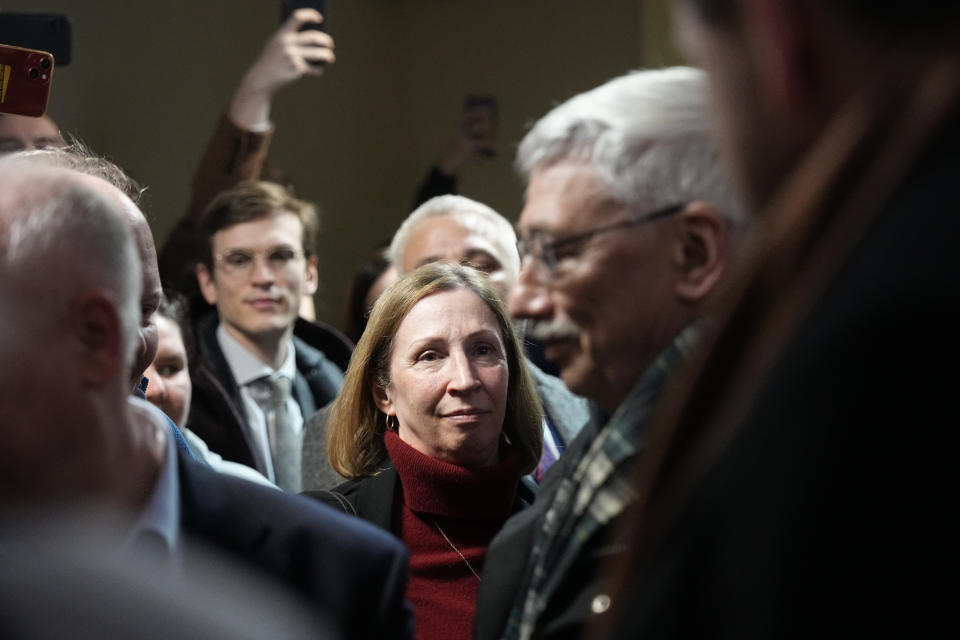 U.S. Ambassador to Russia Lynne Tracy, centre, looks at the co-chair of the Nobel Peace Prize winning Memorial Human Rights Centre Oleg Orlov, right, prior to a court session for his new trial on charges of repeated discrediting Russian military, in Moscow, Russia, on Tuesday, Feb. 27, 2024. (AP Photo/Alexander Zemlianichenko)