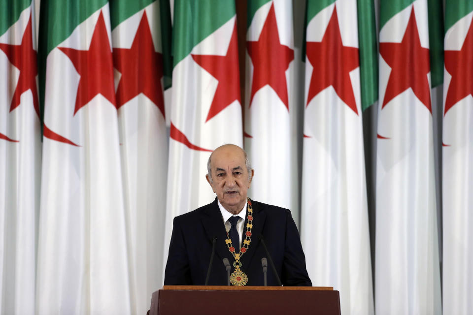 FILE- In this file photo dated Thursday, Dec. 19, 2019, Algerian president Abdelmadjid Tebboune delivers a speech during an inauguration ceremony in the presidential palace, in Algiers, Algeria. Algeria's peaceful "smile revolution" unseated the long-time president of Africa's largest country along with his powerful entourage and struck hard at the corruption they bred, and the new president Tebboune, recently called the movement “blessed.” (AP Photo/Toufik Doudou, FILE)