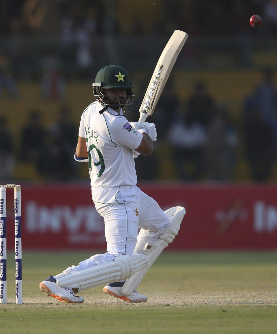 Pakistani captain Azhar Ali hits a boundary in the third day of the second Test cricket match at National Stadium in Karachi, Pakistan, Saturday, Dec. 21, 2019. Ali (57) and Babar Azam (22) were unbeaten at the close of play, but it was Abid and Shan Masood (135) who stole the show earlier with a huge opening stand of 278. (AP Photo/Fareed Khan)