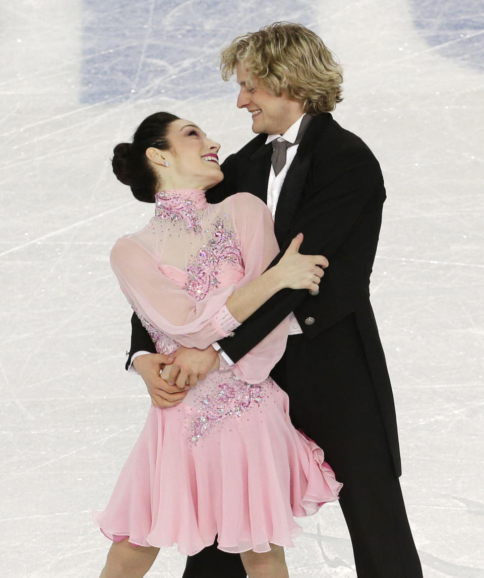 Meryl Davis and Charlie White of the United States compete in the team ice dance short dance figure skating competition at the Iceberg Skating Palace during the 2014 Winter Olympics, Saturday, Feb. 8, 2014, in Sochi, Russia. (AP Photo/Bernat Armangue)