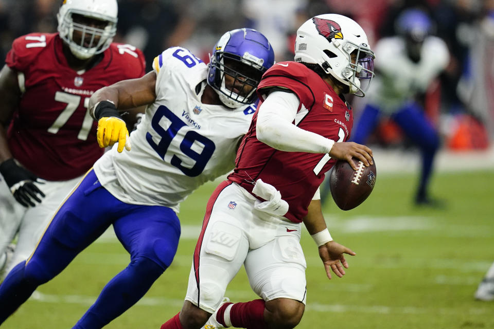 Arizona Cardinals quarterback Kyler Murray (1) scrambles as Minnesota Vikings defensive end Danielle Hunter (99) pursues during the second half of an NFL football game, Sunday, Sept. 19, 2021, in Glendale, Ariz. (AP Photo/Ross D. Franklin)