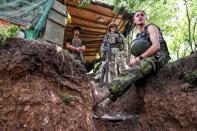 Ukrainian service members are seen at a position near a frontline in Zaporizhzhia region