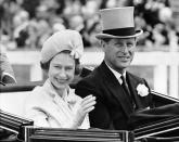 FILE - In this June 19, 1962 file photo, Britain's Prince Philip and his wife Queen Elizabeth II arrive at Royal Ascot race meeting, England. Britain's Prince Philip stood loyally behind behind Queen Elizabeth, as his character does on Netflix's “The Crown.” But how closely does the TV character match the real prince, who died Friday, April 9, 2021 at 99? Philip is depicted as a man of action in “The Crown,” and he served with distinction in the navy in World War II. He was also an avid yachtsman and polo player.AP Photo/File)