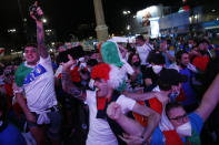 Italian fans celebrate as they watch the Euro 2020, soccer championship group A match between Italy and Turkey, on a mega screen set in downtown Rome, Friday, June 11, 2021. (Cecilia Fabiano/LaPresse via AP)