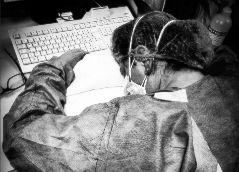 An exhausted medical worker lays on keyboard. The photograph, taken by Francesca Mangiatordi, inspired Sasha Joelle Achilli to make the documentary Inside Italy's COVID War. | Francesca Mangiatordi