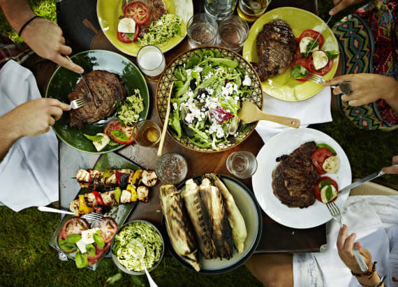 Overhead view of friends dining at table outdoors