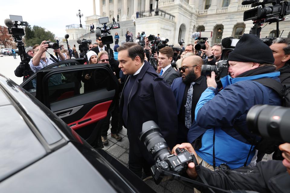 Rep. George Santos (R-NY) is surrounded by journalists as he leaves the U.S. Capitol after his fellow members of Congress voted to expel him from the House of Representatives on December 01, 2023 in Washington, DC (Getty Images)