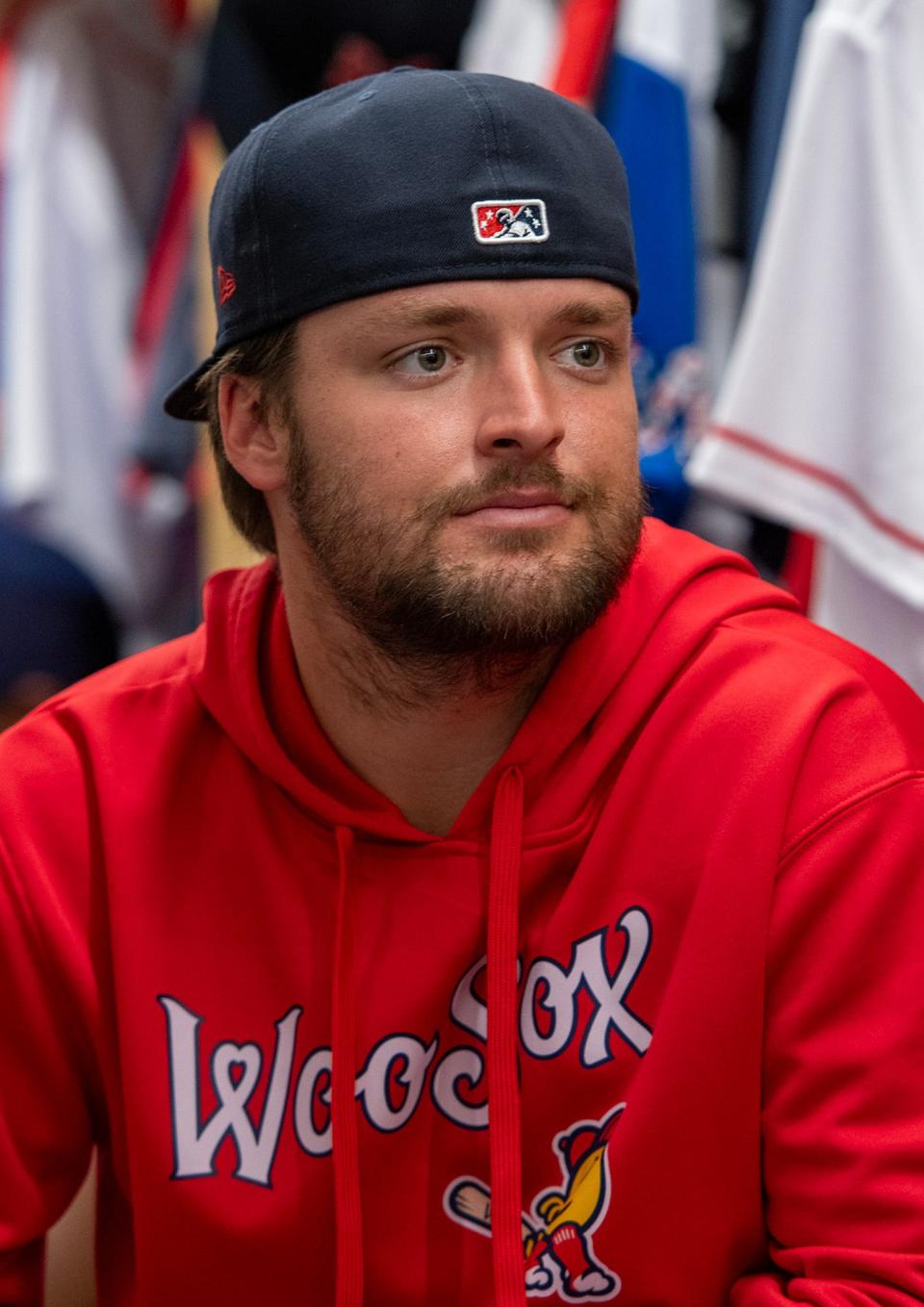 WooSox catcher Nathan Hickey, sporting a beard, talks to reporters on media day at Polar Park on March 27, 2024.